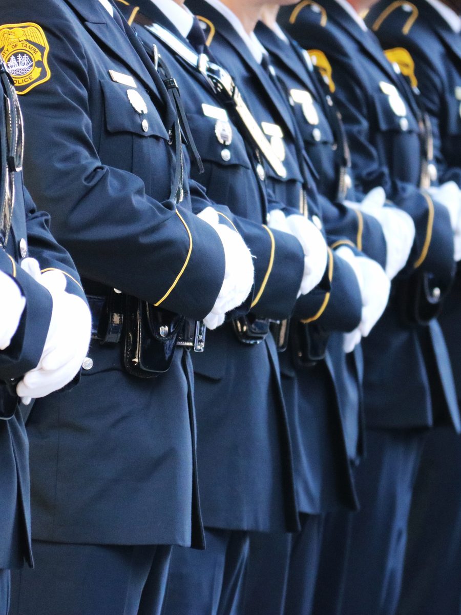 Tampa Police honor guard standing in formation in dress uniform and white gloves